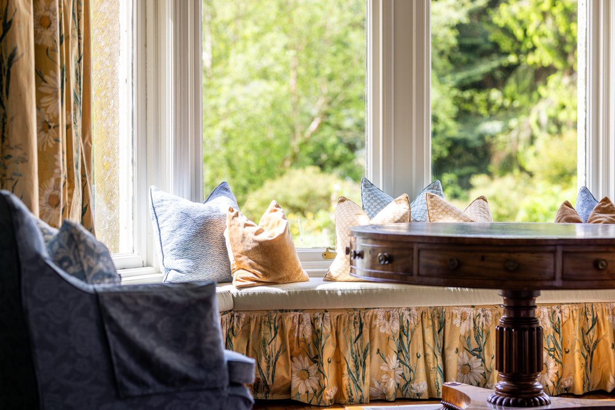 Women practicing gentle yoga in a sunlit villa